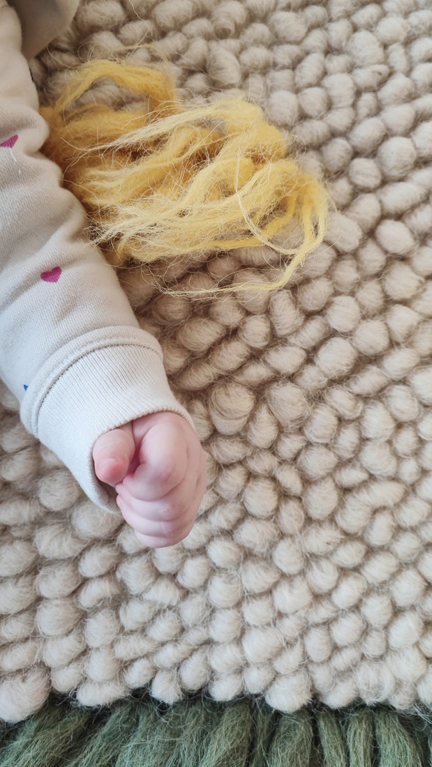 Close-up of the handwoven wool texture of the Zhvanchyk Gulki rug