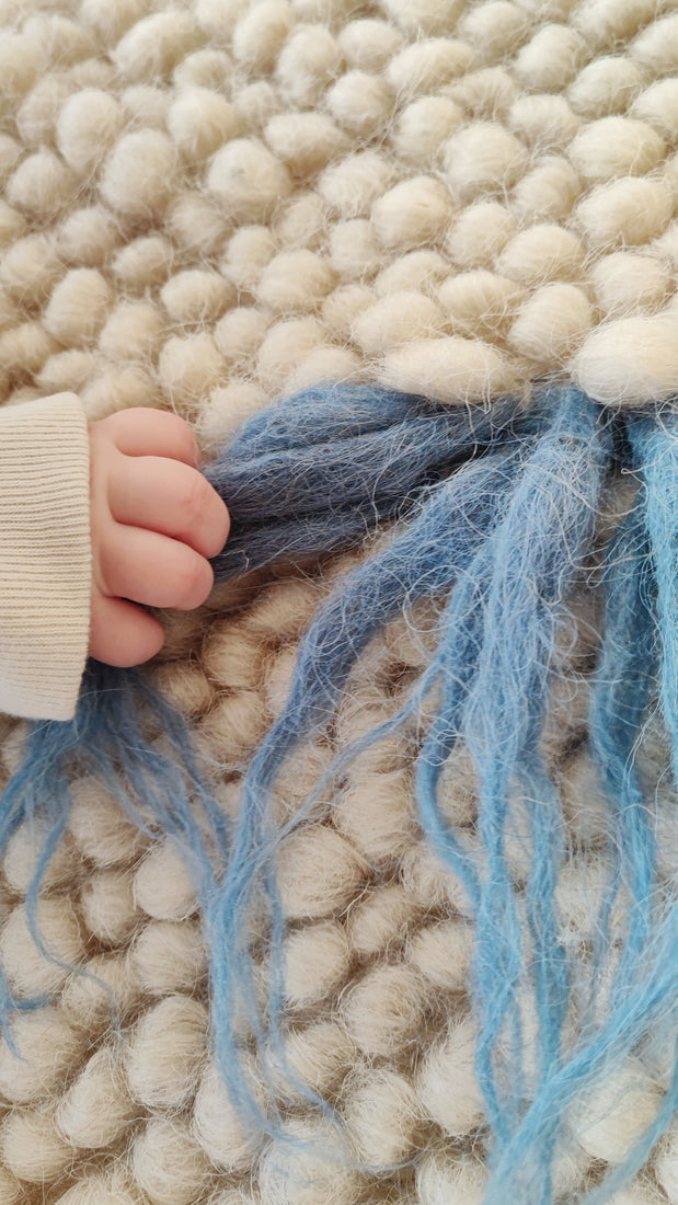 Close-up of the handwoven wool texture of the Zhvanchyk Gulki rug