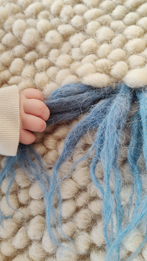 Close-up of the handwoven wool texture of the Zhvanchyk Gulki rug