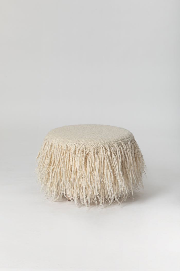 Handcrafted Mapico wool Pouf on the white background