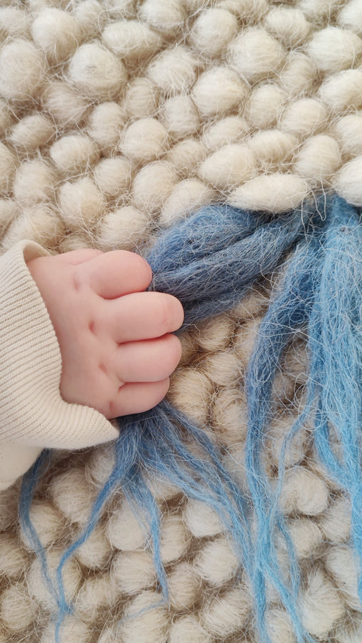 Close-up of the handwoven wool texture of the Zhvanchyk Gulki rug